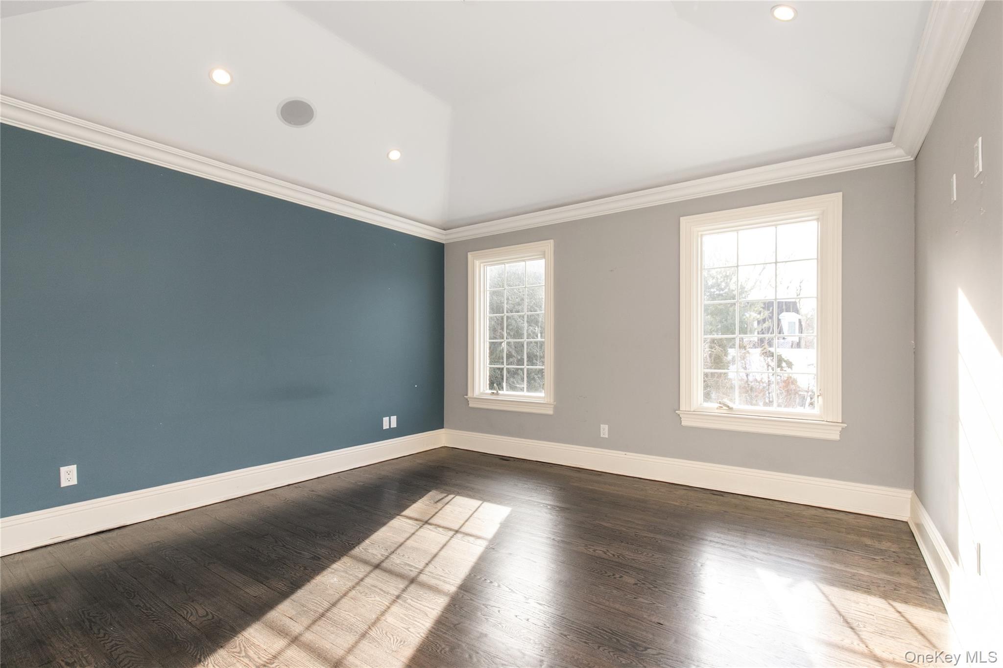 12 Knollwood Road Roslyn, NY 11576 - Photo 28 of 41 a view of an empty room with wooden floor and a window