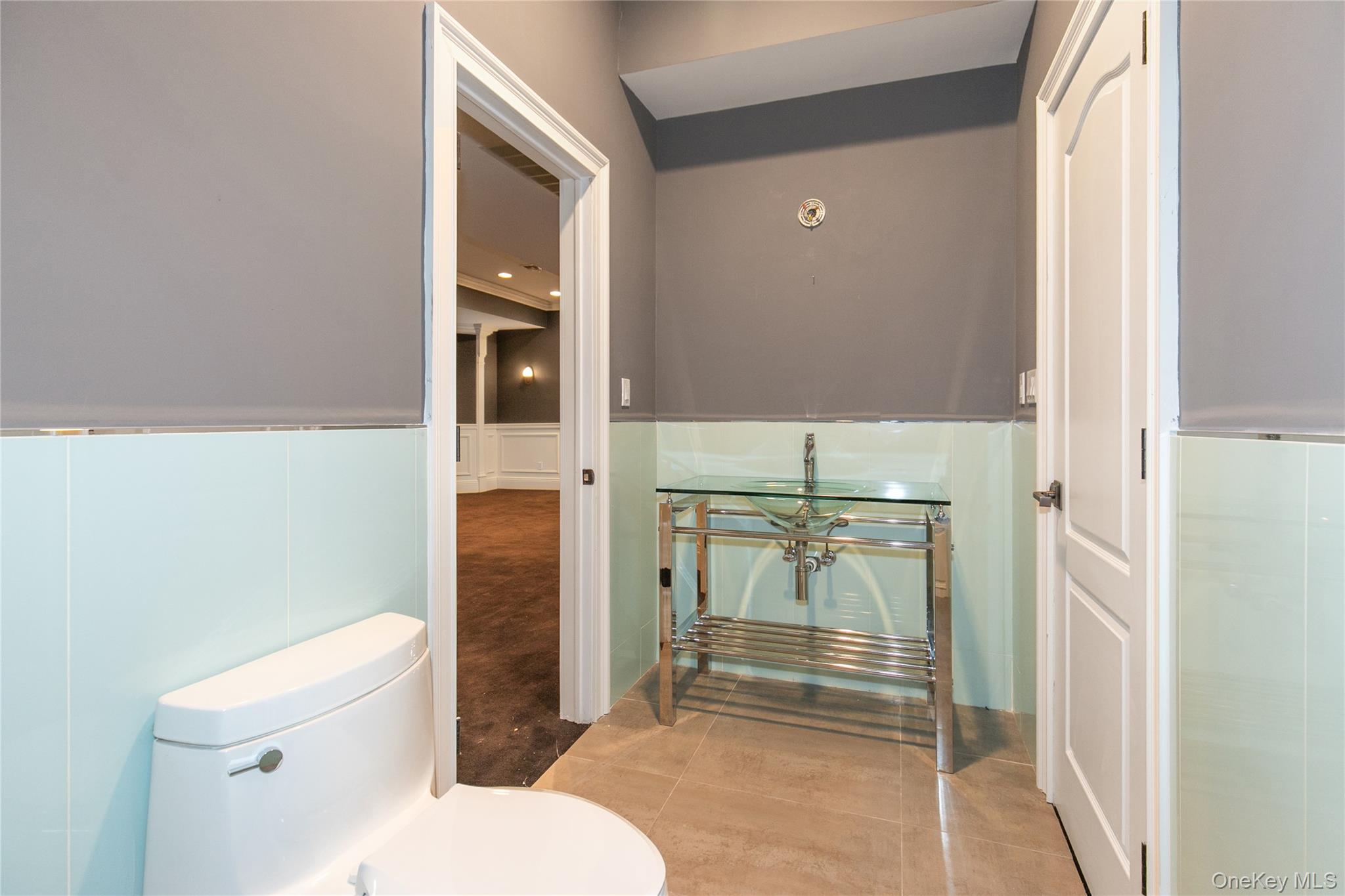12 Knollwood Road Roslyn, NY 11576 - Photo 35 of 41 a bathroom with a toilet and a shower