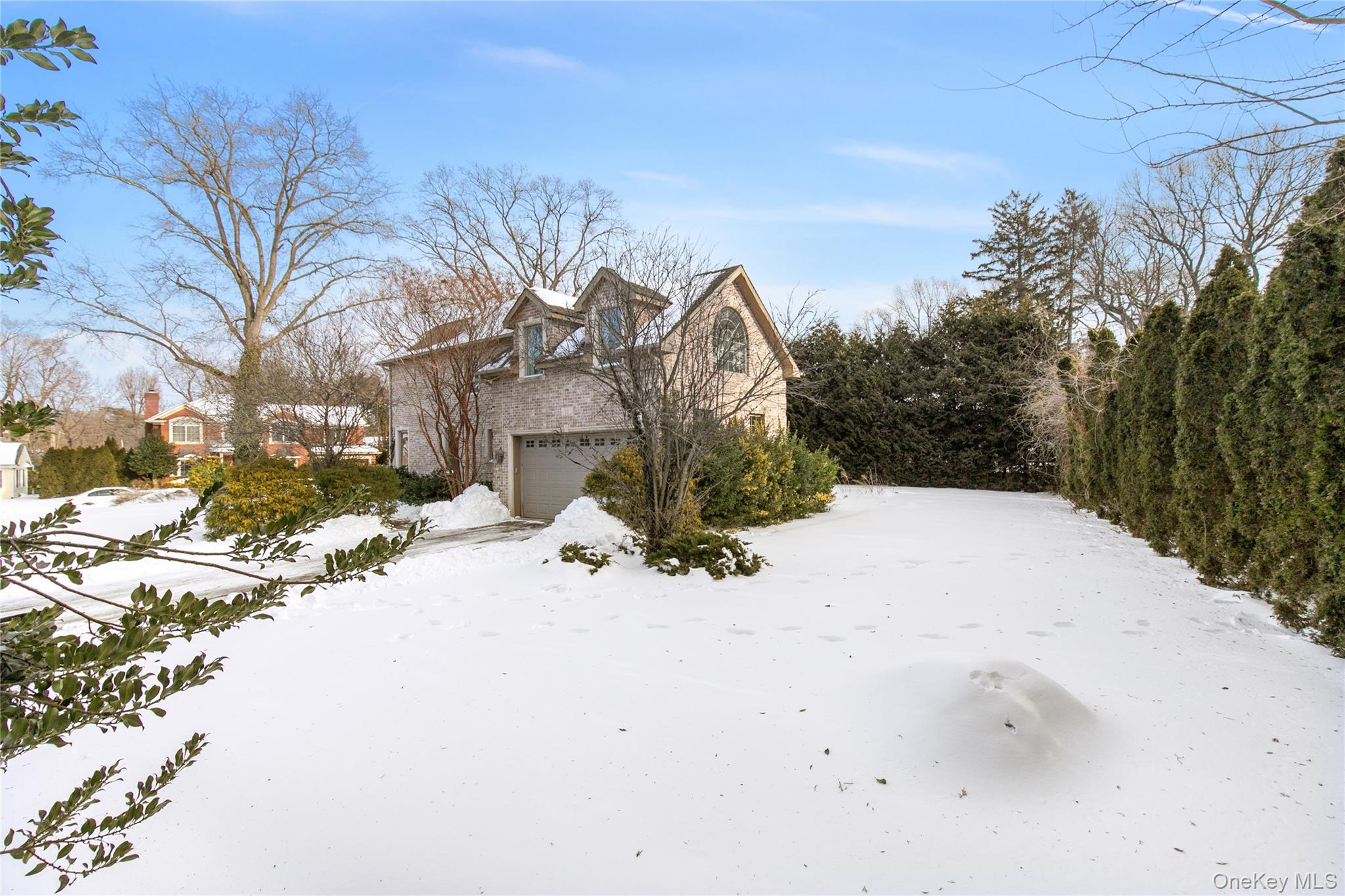 12 Knollwood Road Roslyn, NY 11576 - Photo 39 of 41 a view of a road with a snow on the road