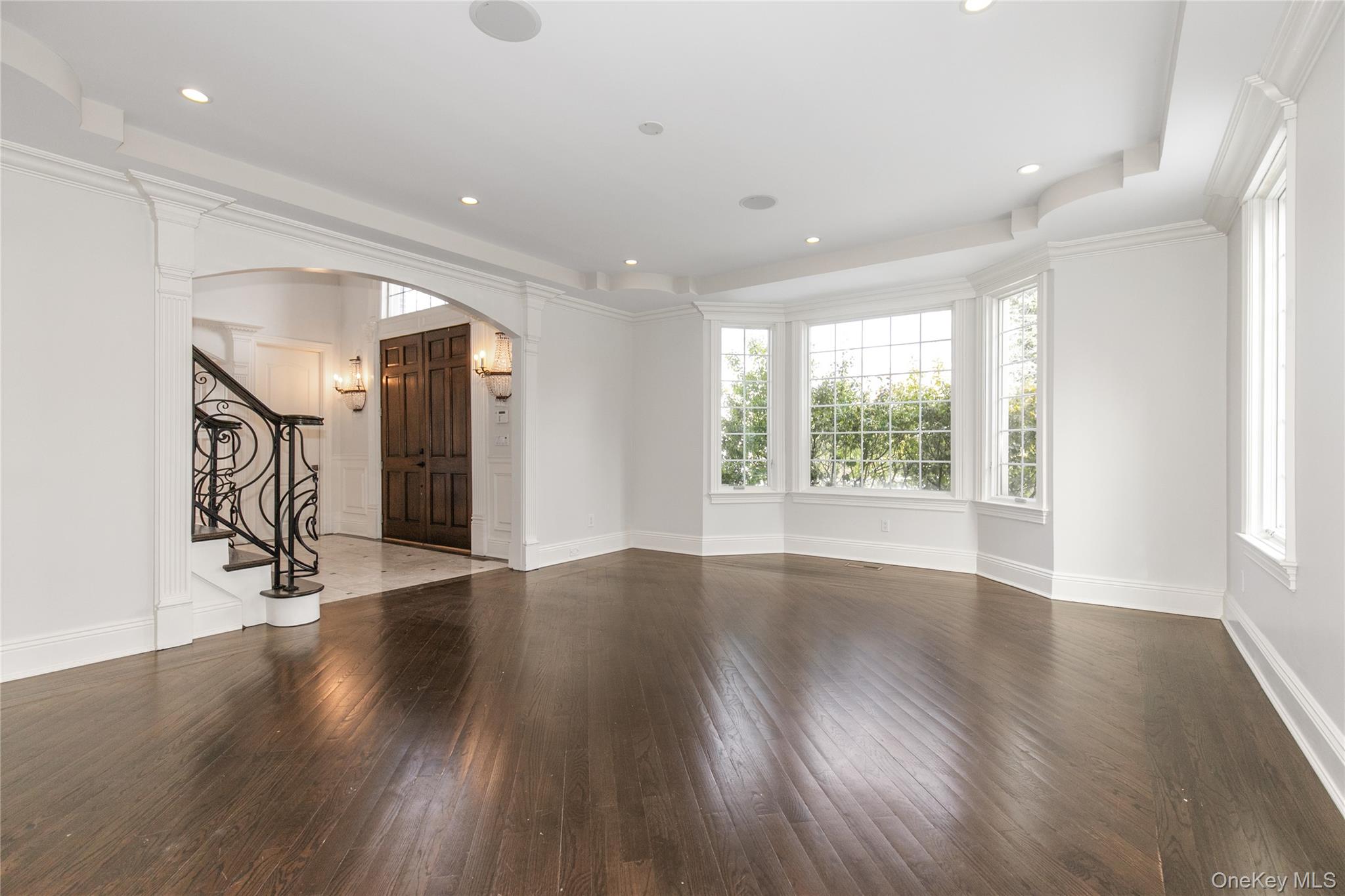 12 Knollwood Road Roslyn, NY 11576 - Photo 6 of 41 an empty room with wooden floor and a window