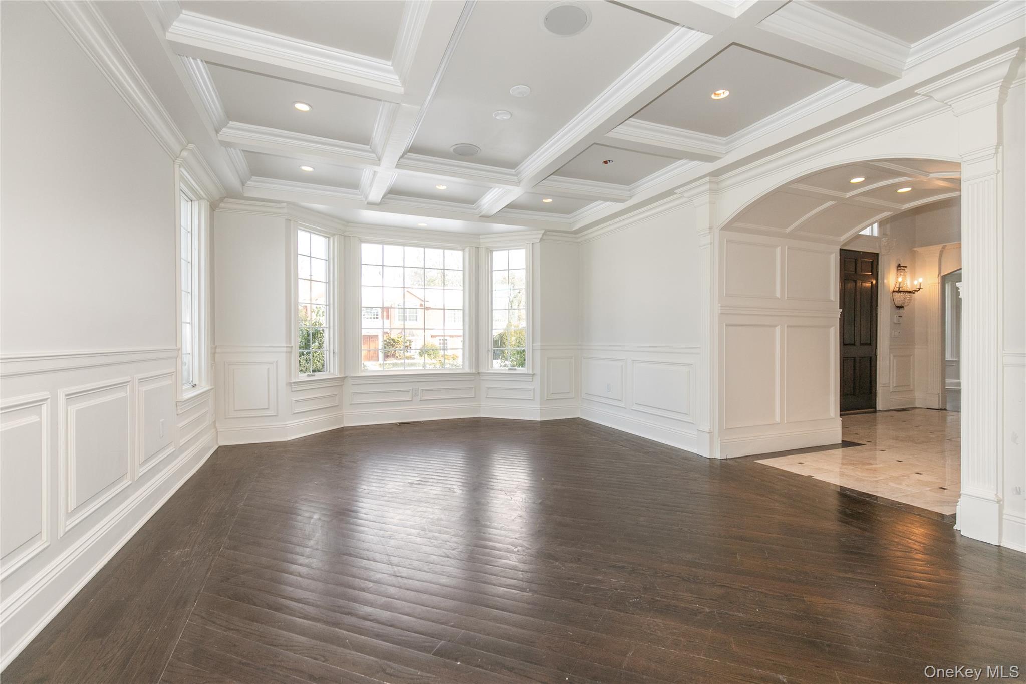 12 Knollwood Road Roslyn, NY 11576 - Photo 8 of 41 a view of an empty room with wooden floor and a window
