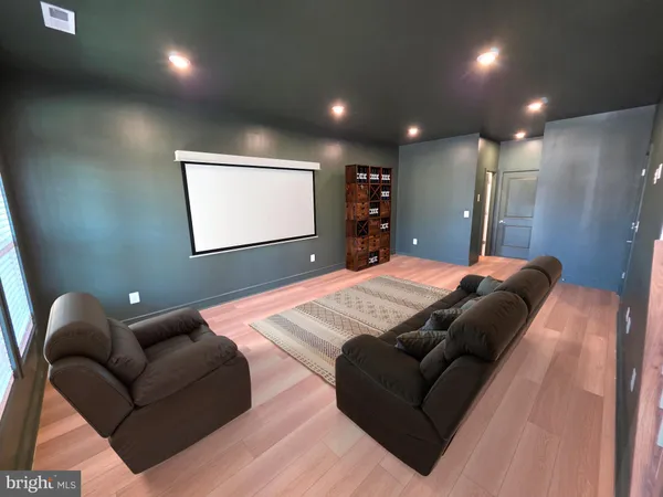a bedroom with a bed window and couch