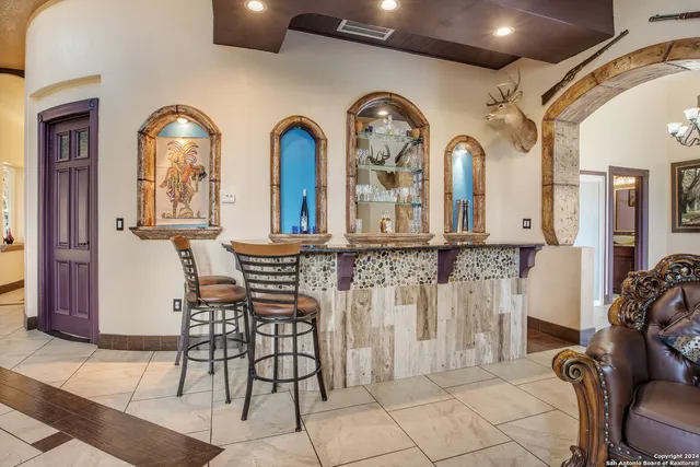 a view of a livingroom with furniture and bathroom