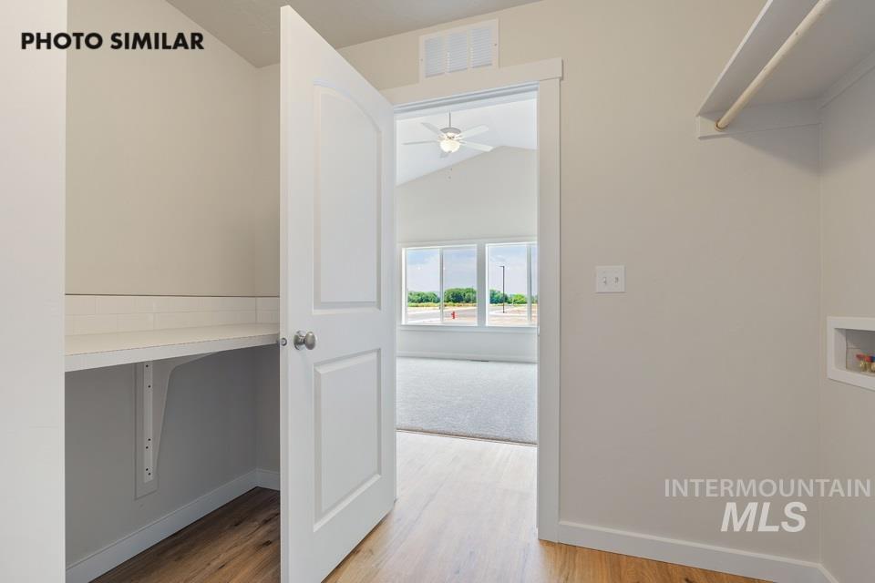 1708 Rapid Road Emmett, ID 83617 - Photo 31 of 33 Dedicated laundry area featuring a built-in shelf, clothing rod, and utility hookups