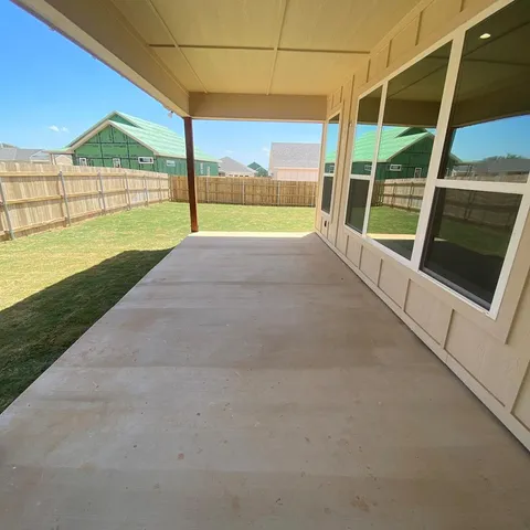 a view of an empty room with a balcony