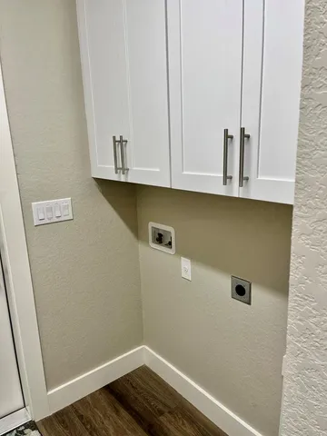 a view of cabinets and wooden floor