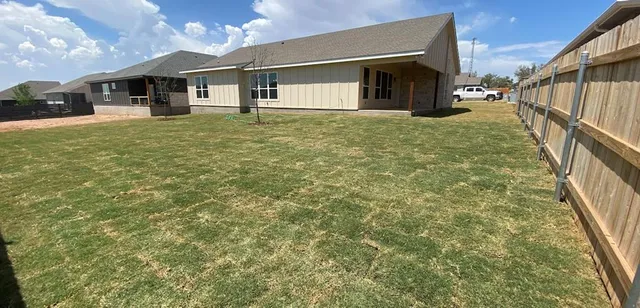 a house view with a garden space