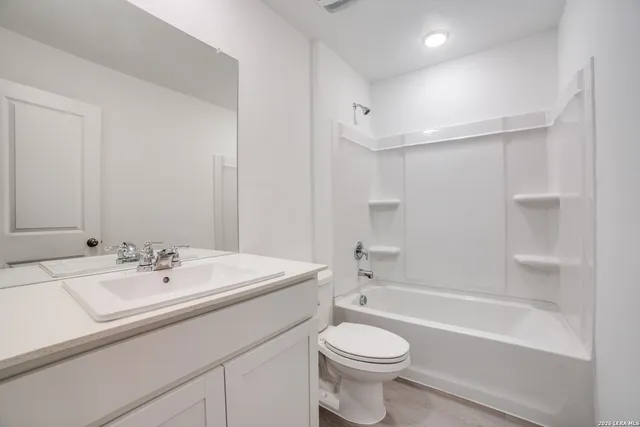 a bathroom with a sink a toilet and a bathtub