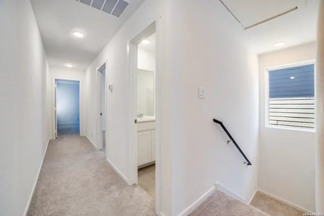 a view of a hallway with closet and entryway