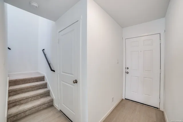 a view of a hallway with staircase