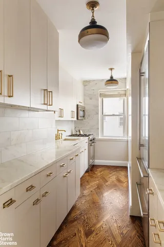 a bathroom with a sink a vanity and a mirror