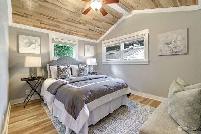 a bedroom with bed and window