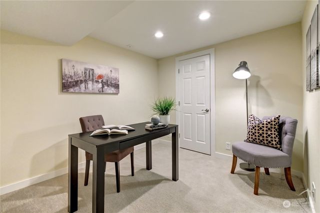 a view of a workspace with furniture