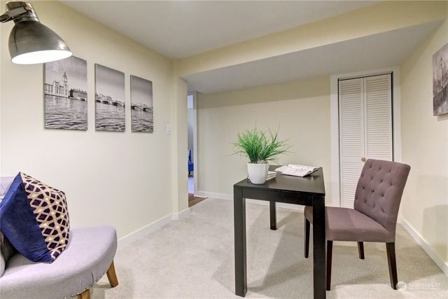 a dining room with furniture and window