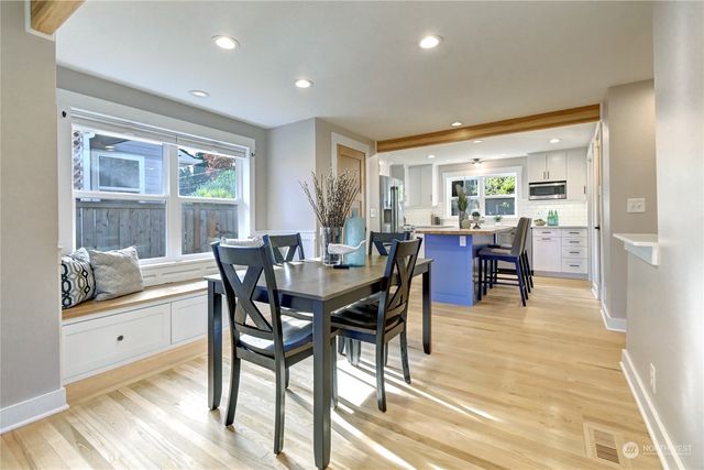 a view of a dining room with furniture and window
