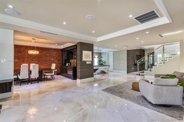 a lobby with furniture and a potted plant