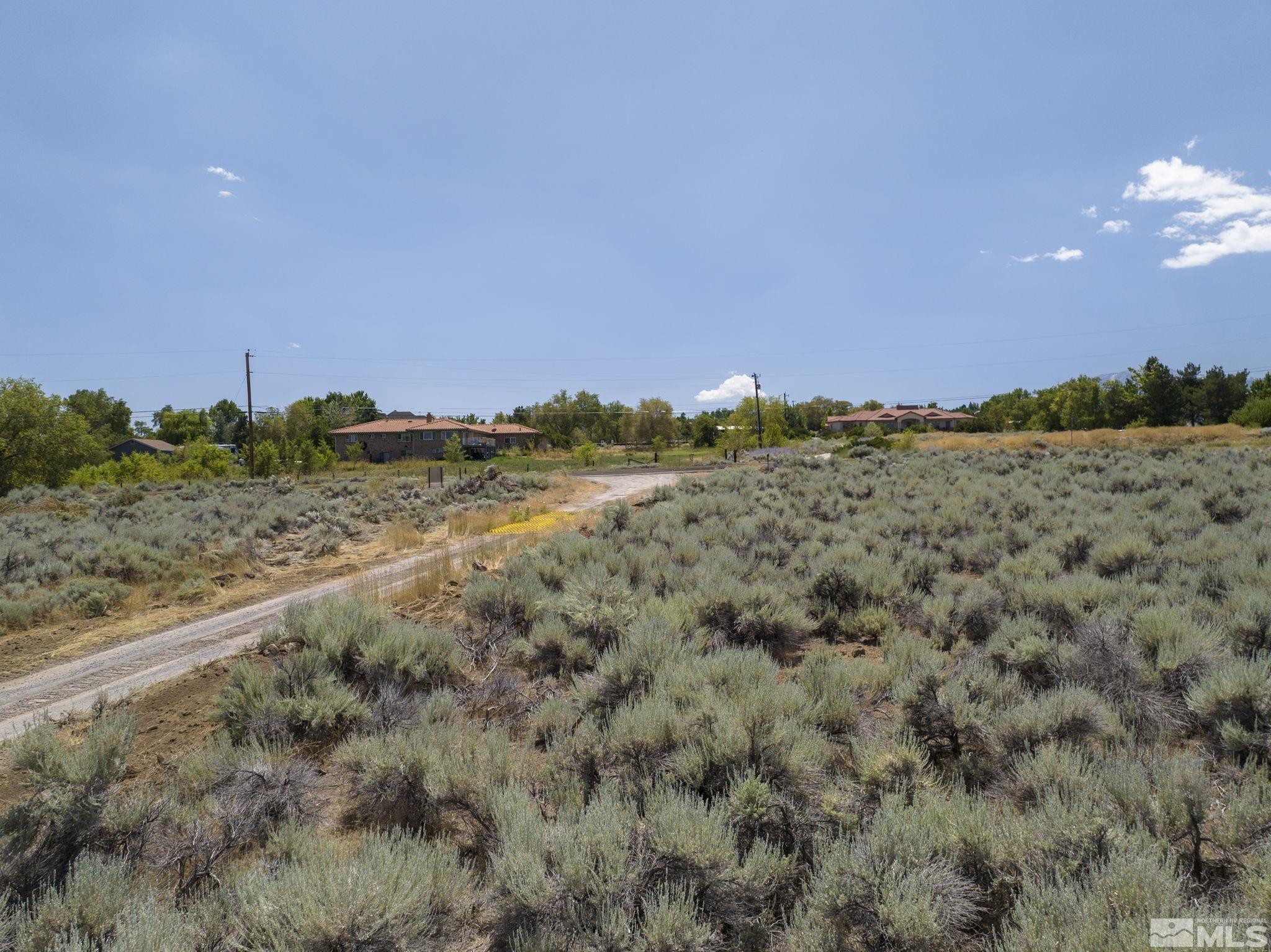 13 Glenhaven Drive Reno, NV 89511 - Photo 4 of 13 a view of a field with trees in background