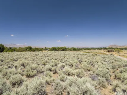 a view of a large building with a mountain in the background