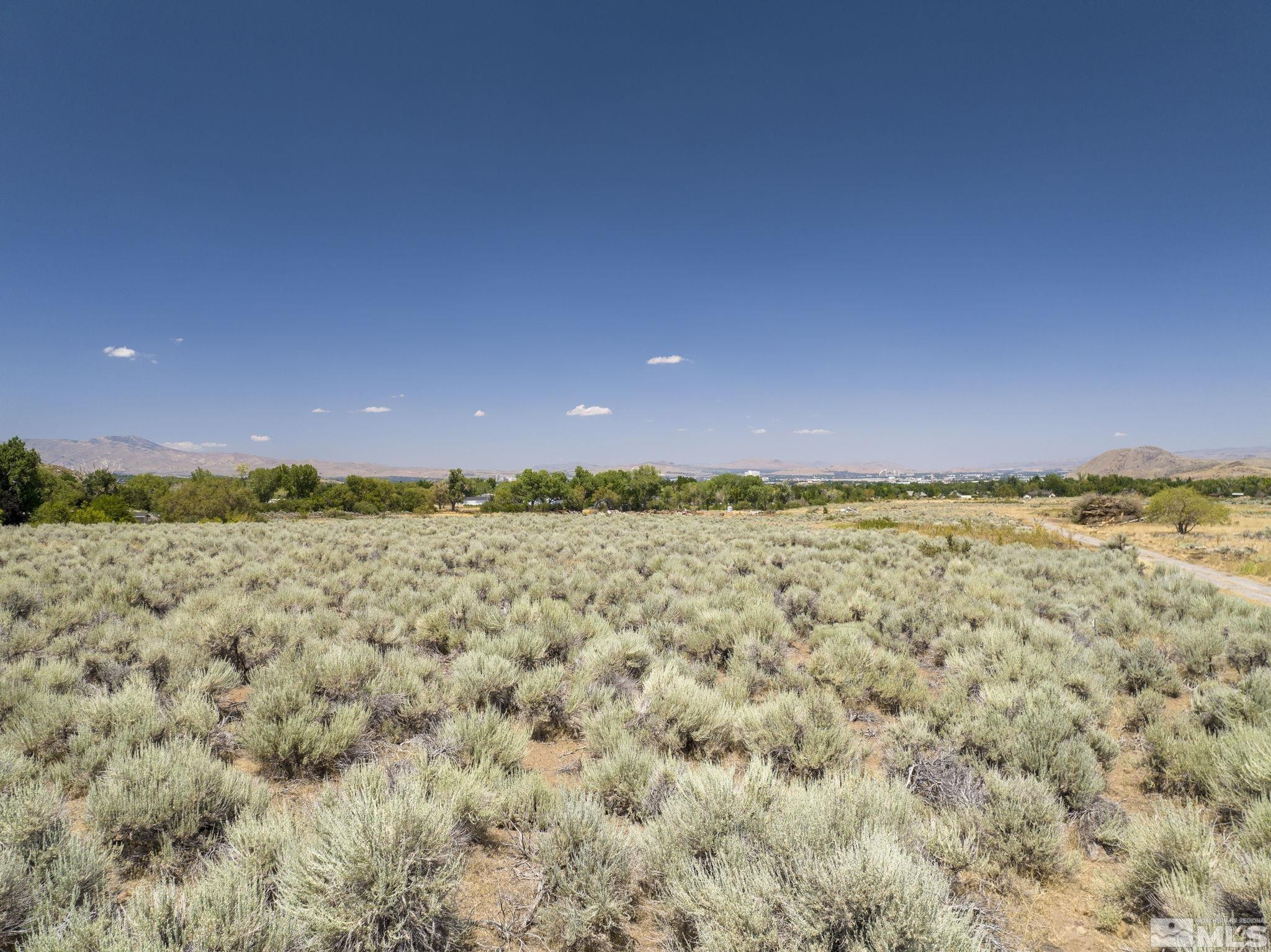 13 Glenhaven Drive Reno, NV 89511 - Photo 6 of 13 a view of a large building with a mountain in the background