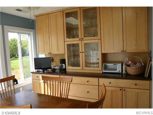 2135 Proffitt Road Manakin-Sabot, VA 23103 - Photo 8 of 12 a kitchen with a window a sink and a cabinets