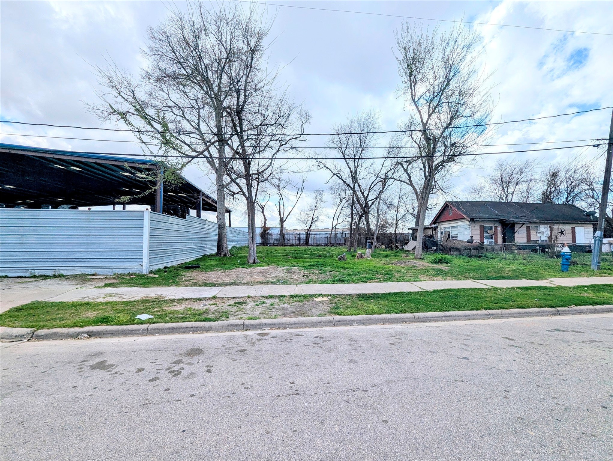 0 Farqueson Street Houston, TX 77029 - Photo 2 of 3 a front view of a house with a yard and a garden