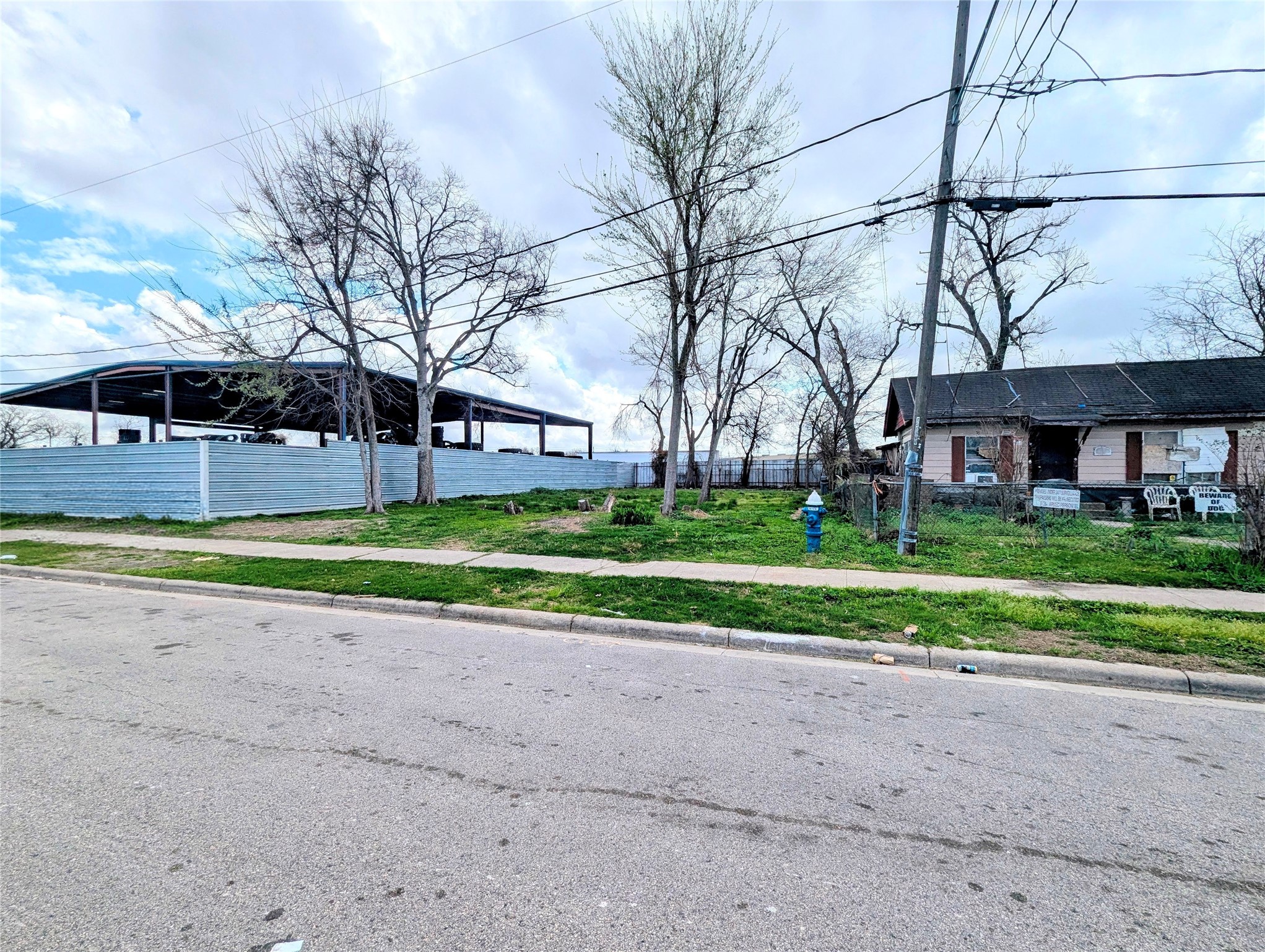 0 Farqueson Street Houston, TX 77029 - Photo 3 of 3 a view of a house with a big yard and large trees