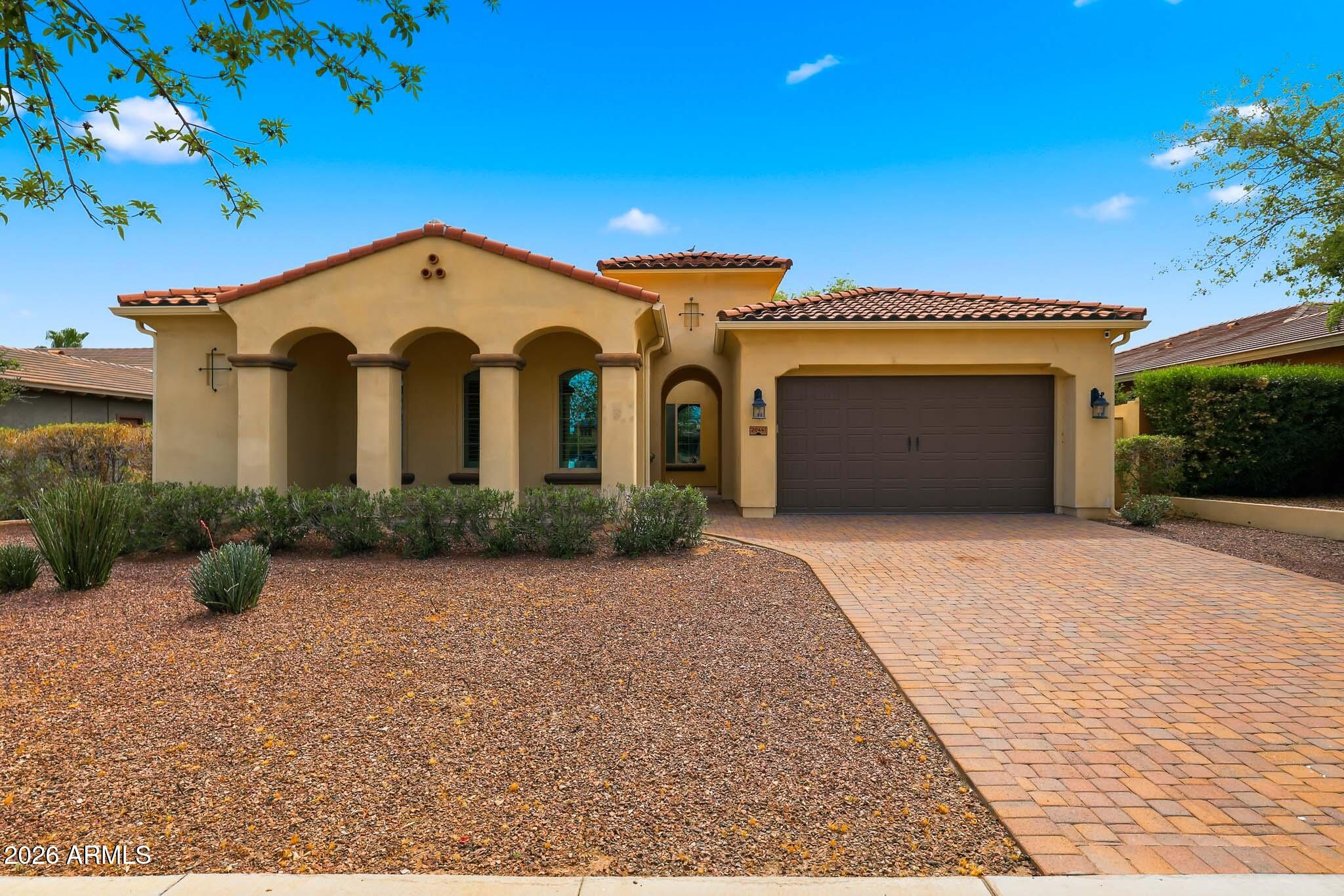 20441 West Hamilton Street Buckeye, AZ 85396 - Photo 2 of 88 a front view of a house with a yard