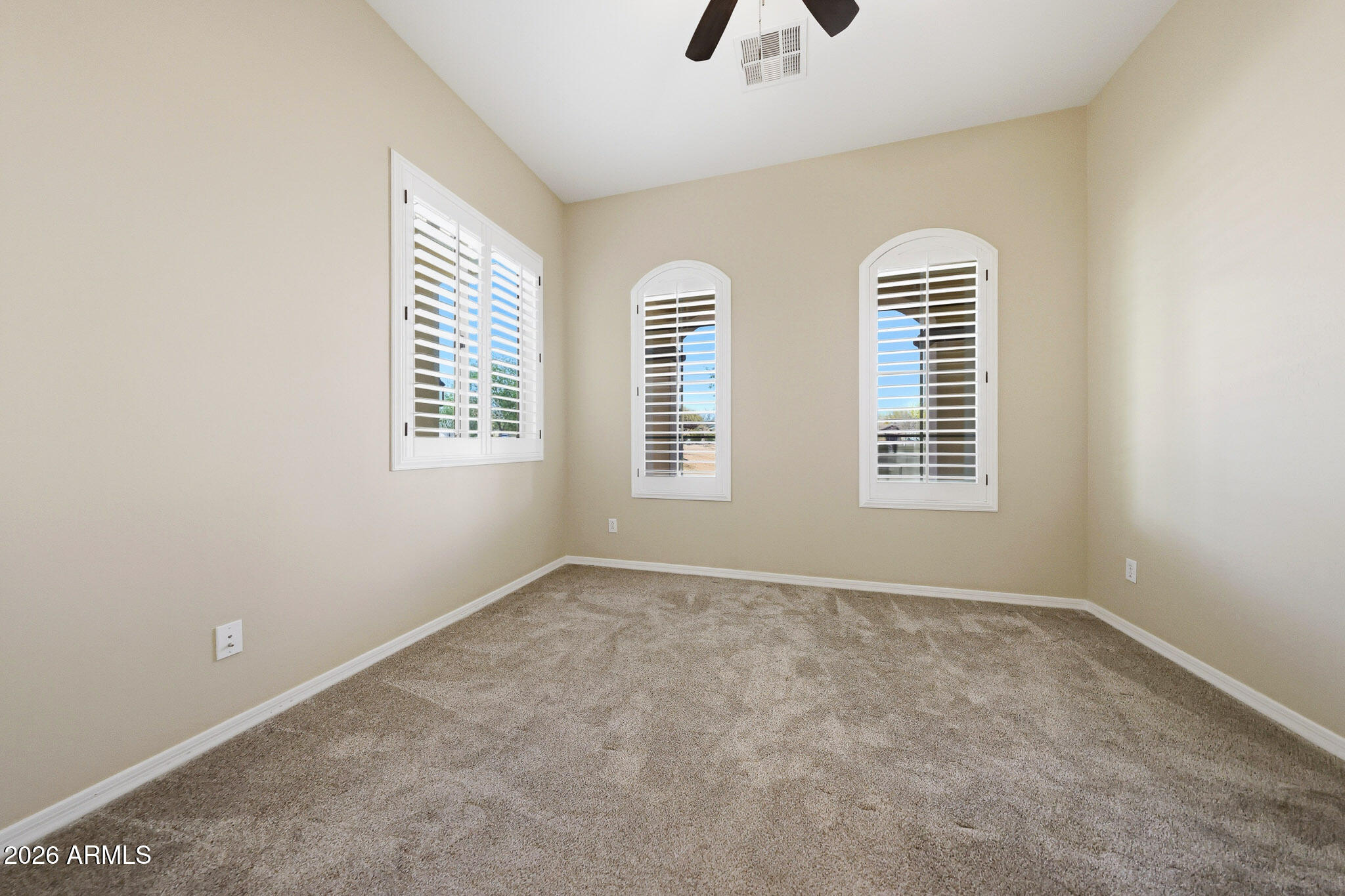 20441 West Hamilton Street Buckeye, AZ 85396 - Photo 31 of 88 a view of an empty room with a window