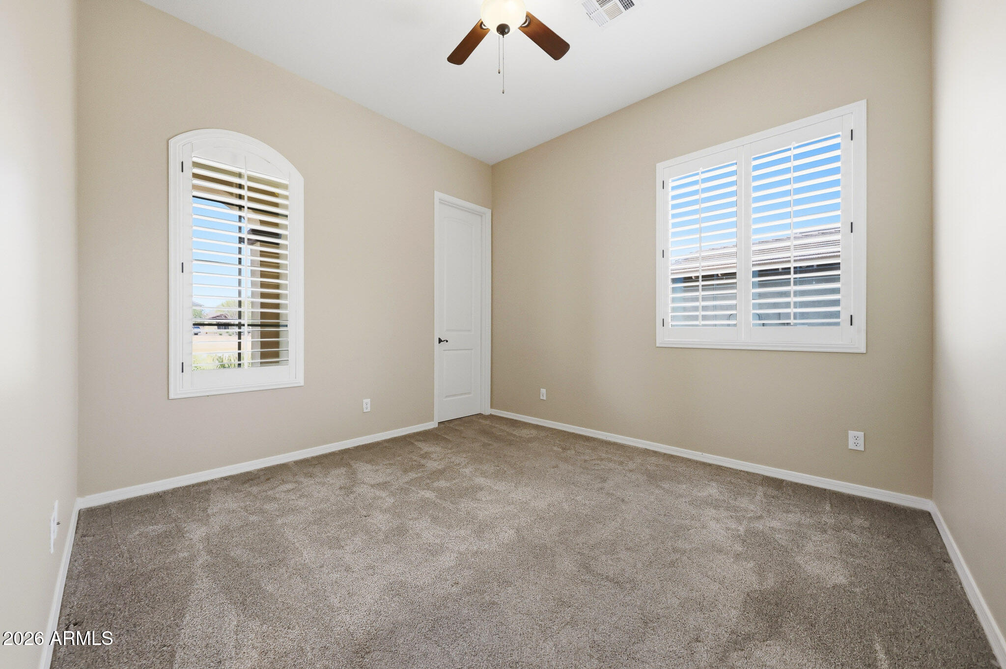 20441 West Hamilton Street Buckeye, AZ 85396 - Photo 33 of 88 a view of an empty room with a window