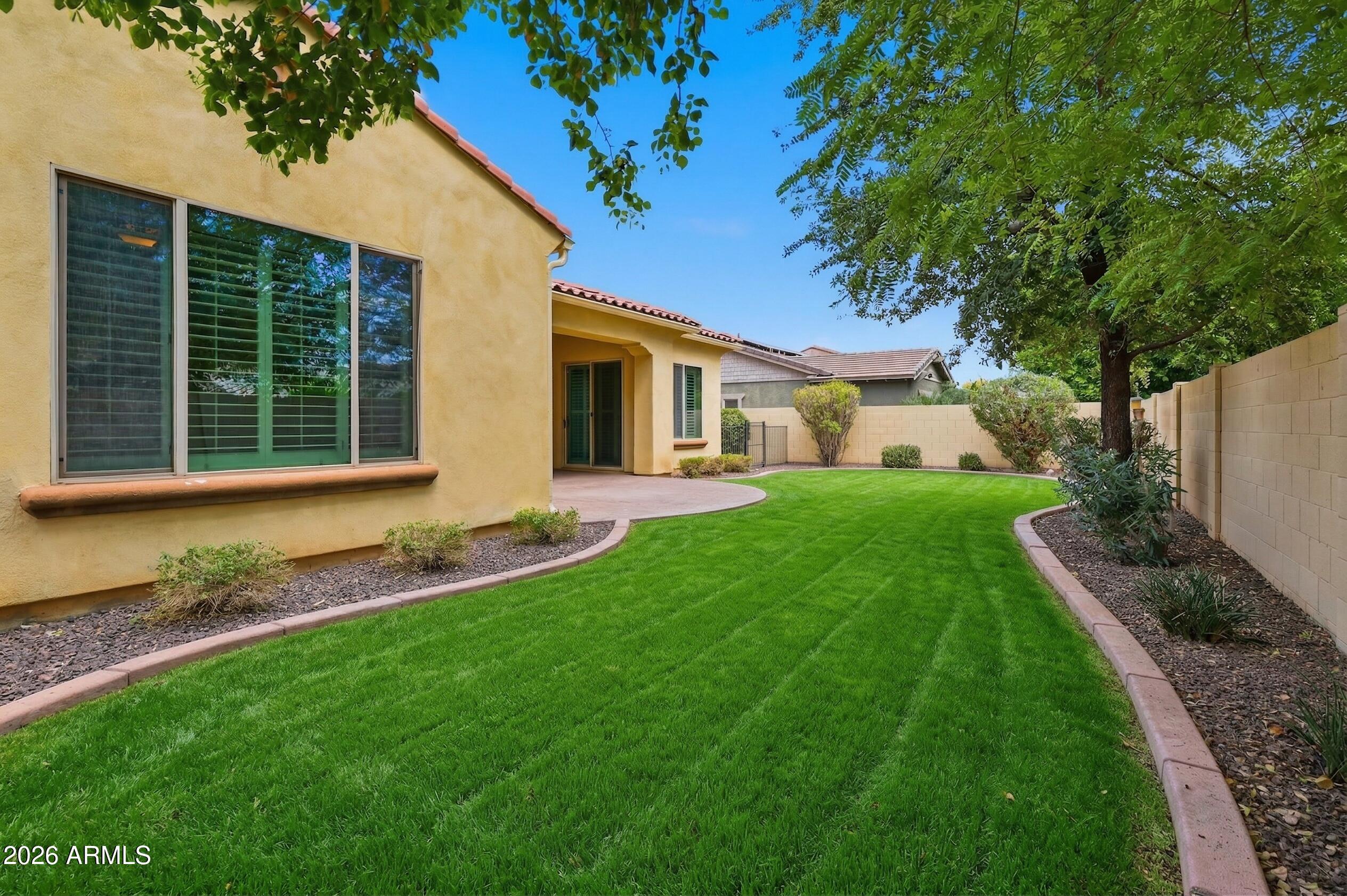 20441 West Hamilton Street Buckeye, AZ 85396 - Photo 42 of 88 a view of house with backyard