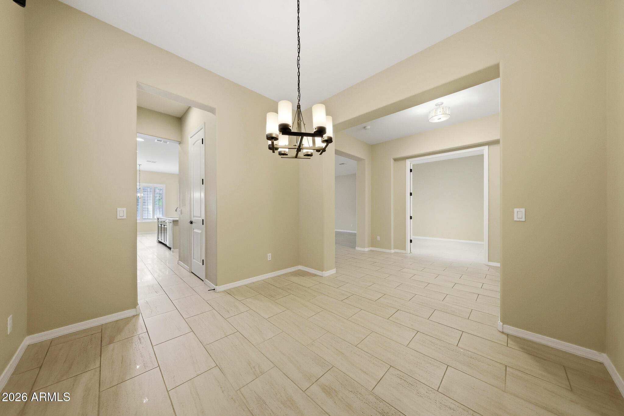 20441 West Hamilton Street Buckeye, AZ 85396 - Photo 9 of 88 a view of a chandelier in an empty room