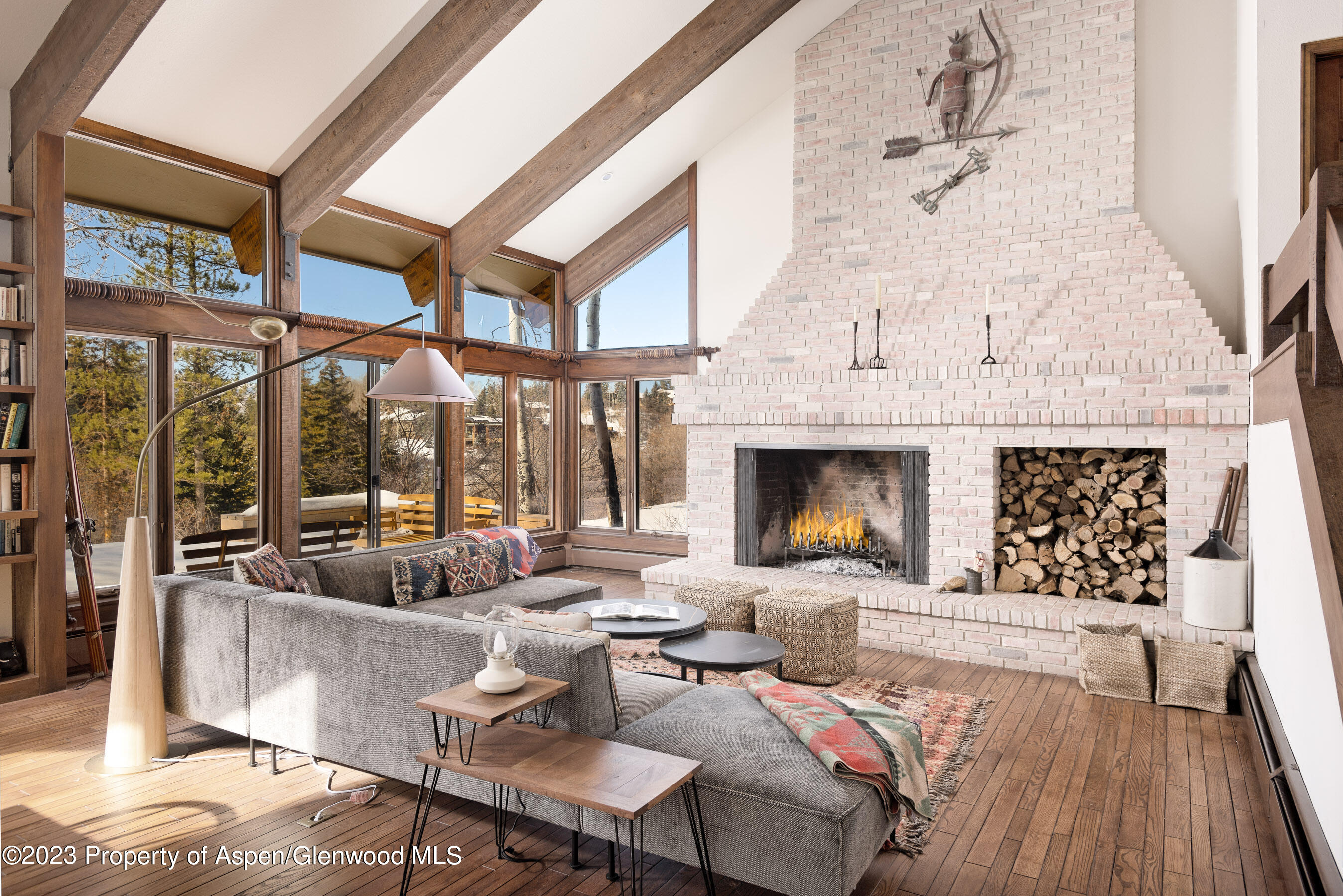 1036 Red Mountain Road Aspen, CO 81611 - Photo 1 of 37 a living room with furniture and a fireplace