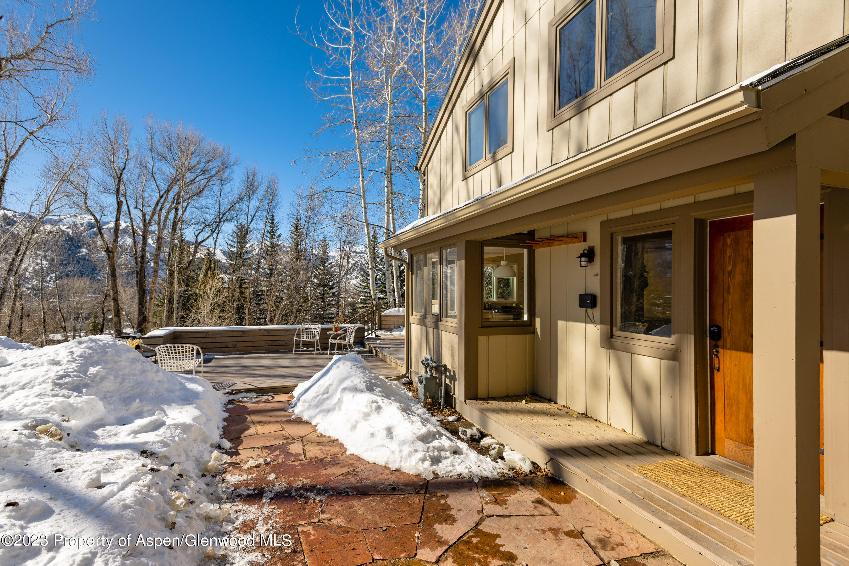 1036 Red Mountain Road Aspen, CO 81611 - Photo 20 of 37 a view of a patio with chair and tables