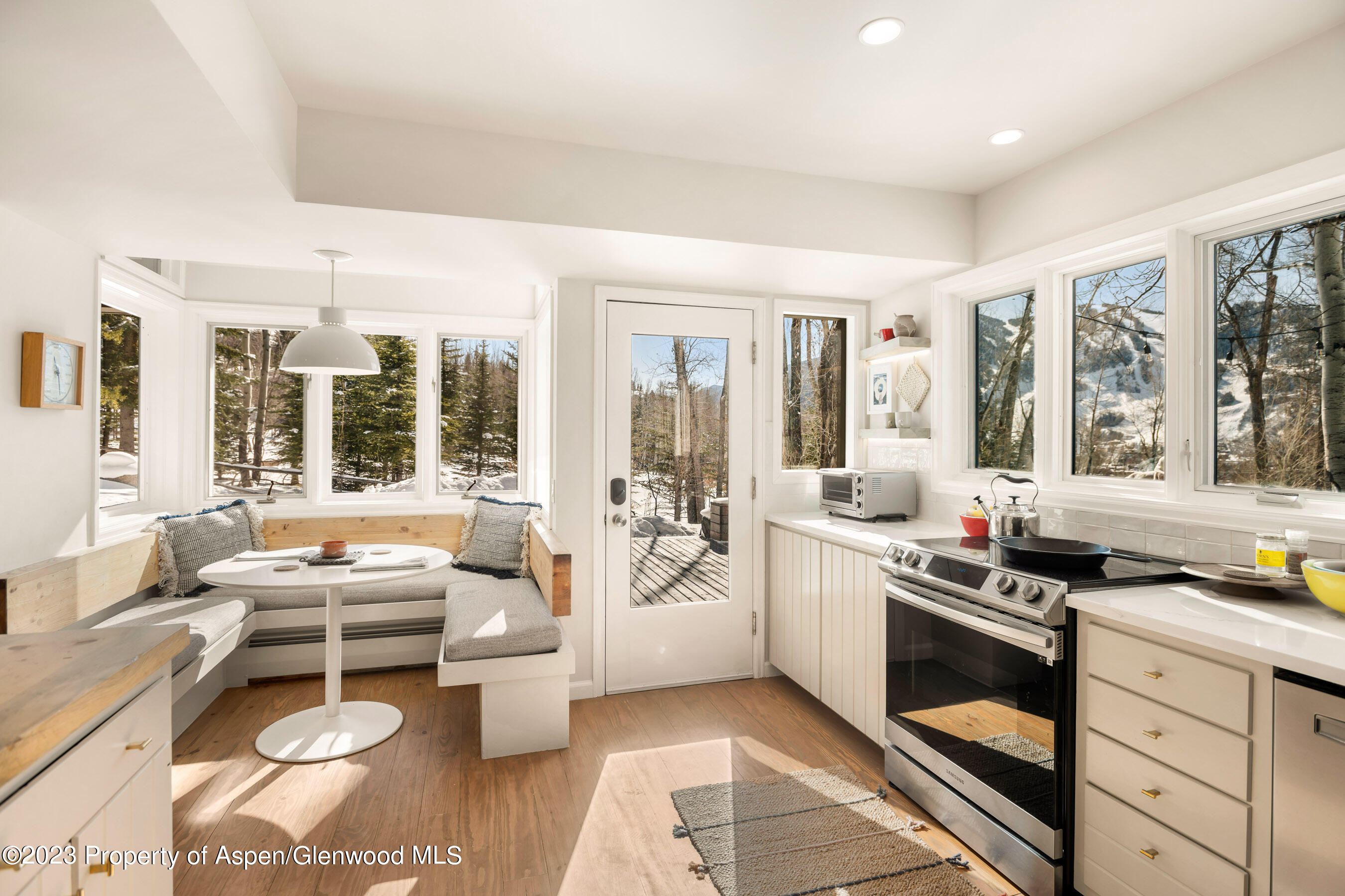 1036 Red Mountain Road Aspen, CO 81611 - Photo 2 of 37 a kitchen with a sink stove and cabinets