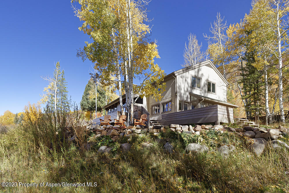 1036 Red Mountain Road Aspen, CO 81611 - Photo 28 of 37 a view of a house with a yard