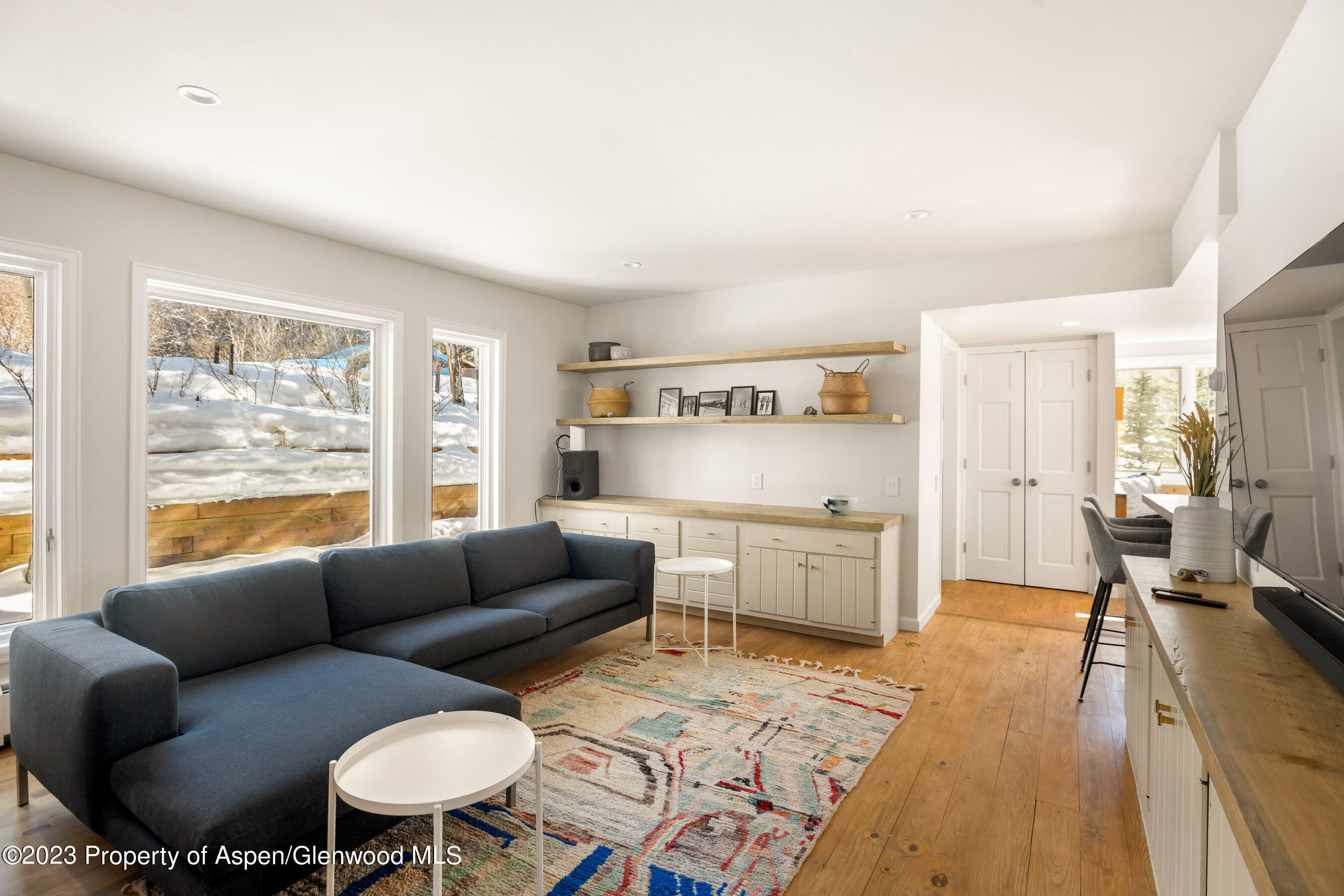 1036 Red Mountain Road Aspen, CO 81611 - Photo 7 of 37 a living room with furniture and a large window