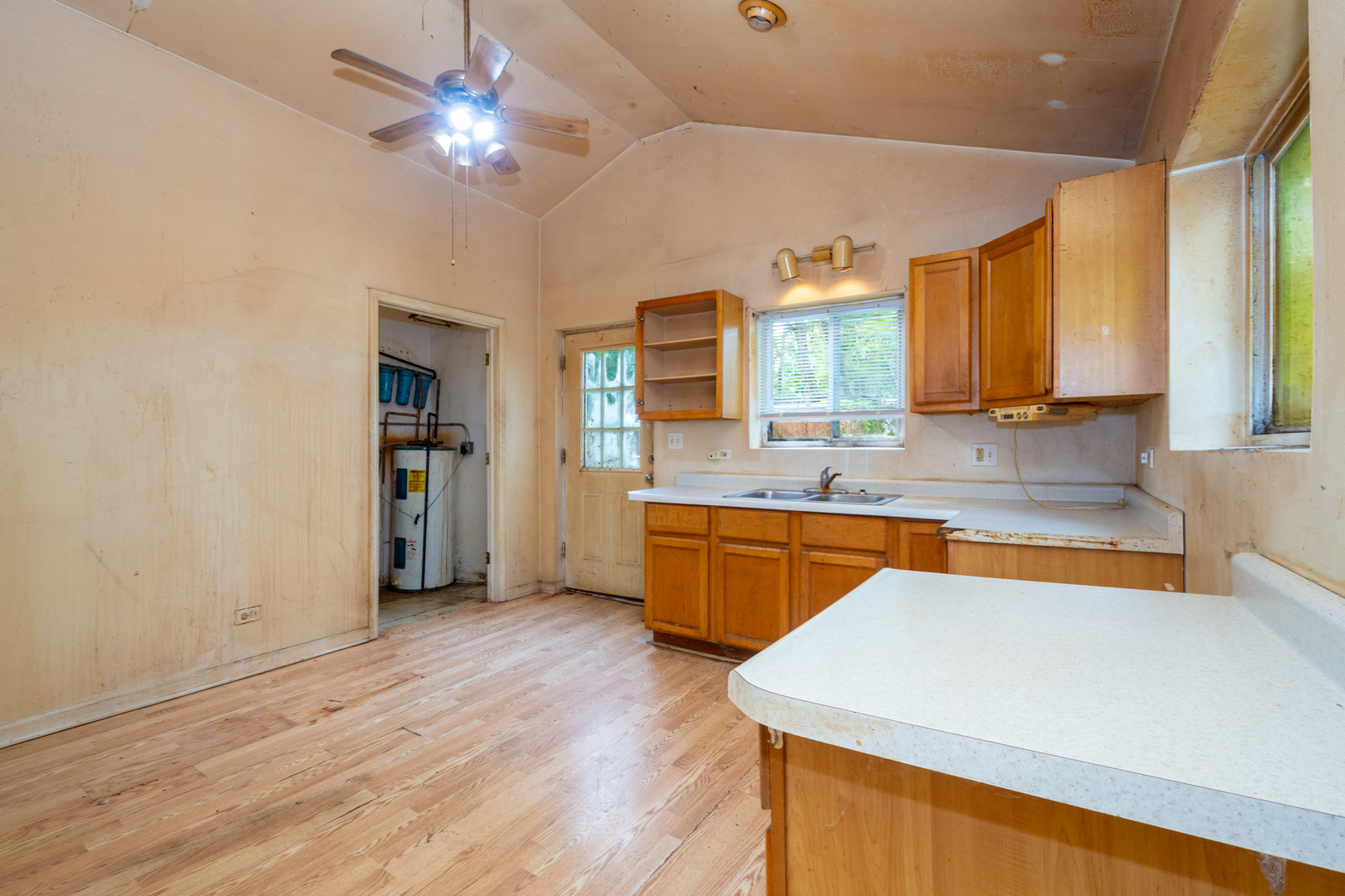 38178 1st Avenue Spring Grove, IL 60081 - Photo 12 of 19 a kitchen with stainless steel appliances granite countertop a sink cabinets and wooden floor