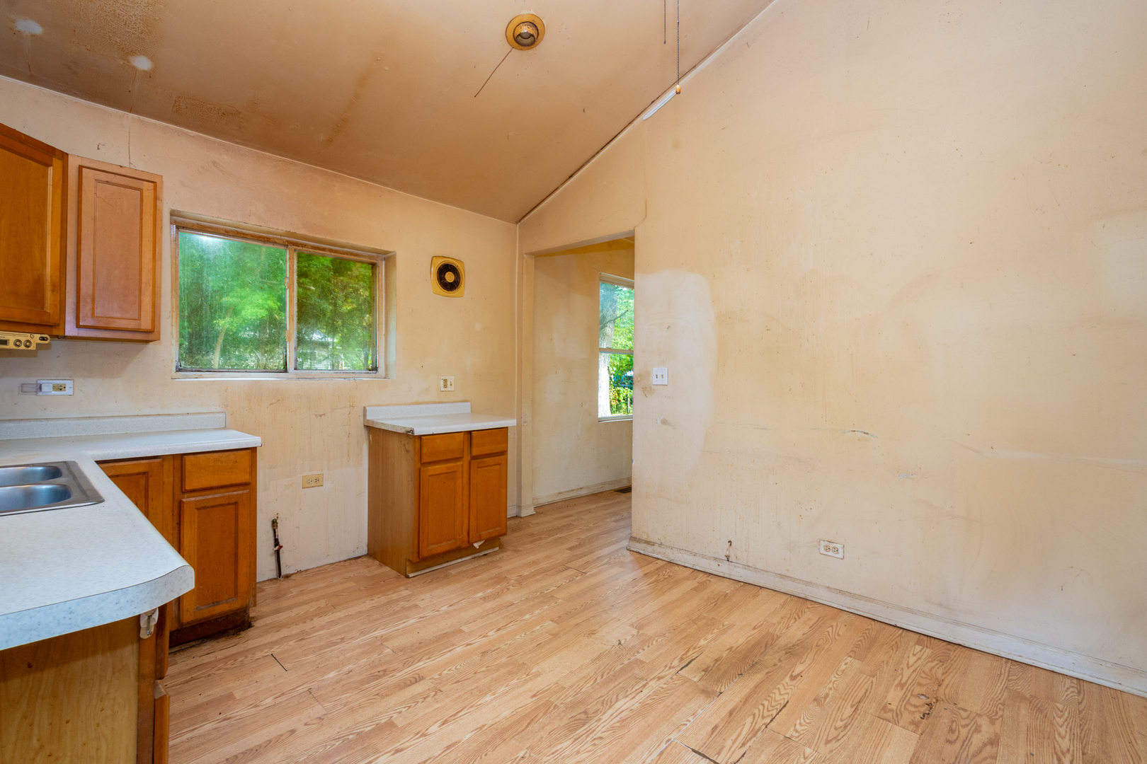 38178 1st Avenue Spring Grove, IL 60081 - Photo 13 of 19 an empty room with a window and kitchen view