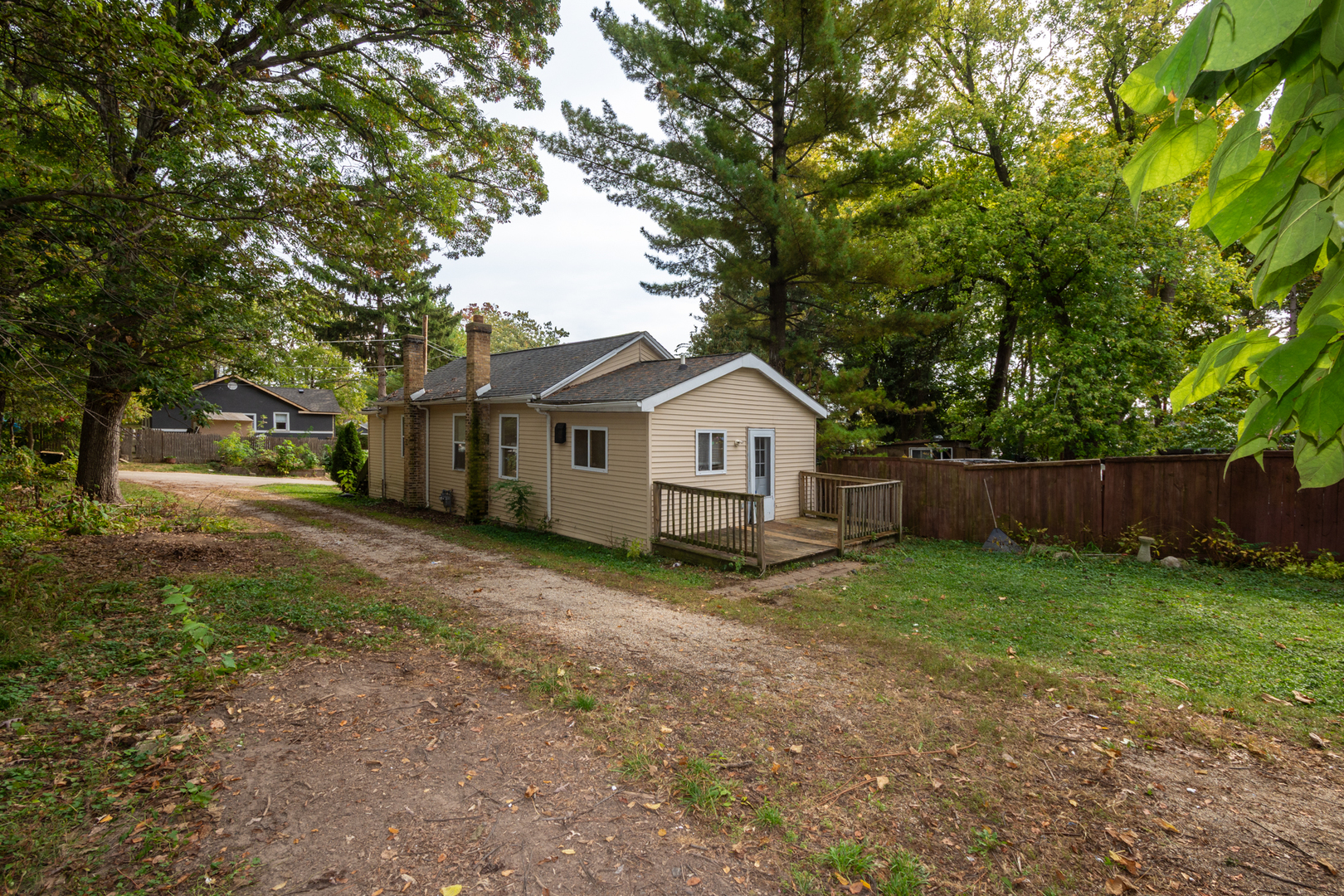 38178 1st Avenue Spring Grove, IL 60081 - Photo 18 of 19 a view of a yard with wooden fence and trees