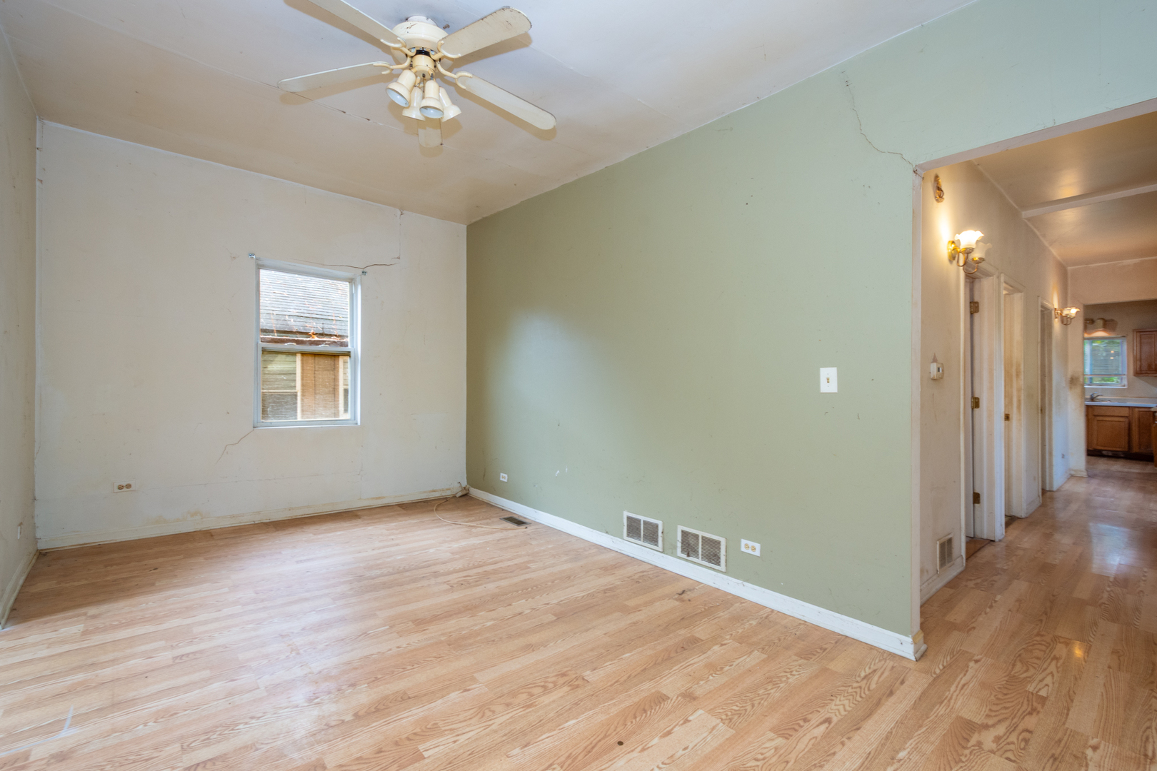 38178 1st Avenue Spring Grove, IL 60081 - Photo 6 of 19 wooden floor in an empty room with a window
