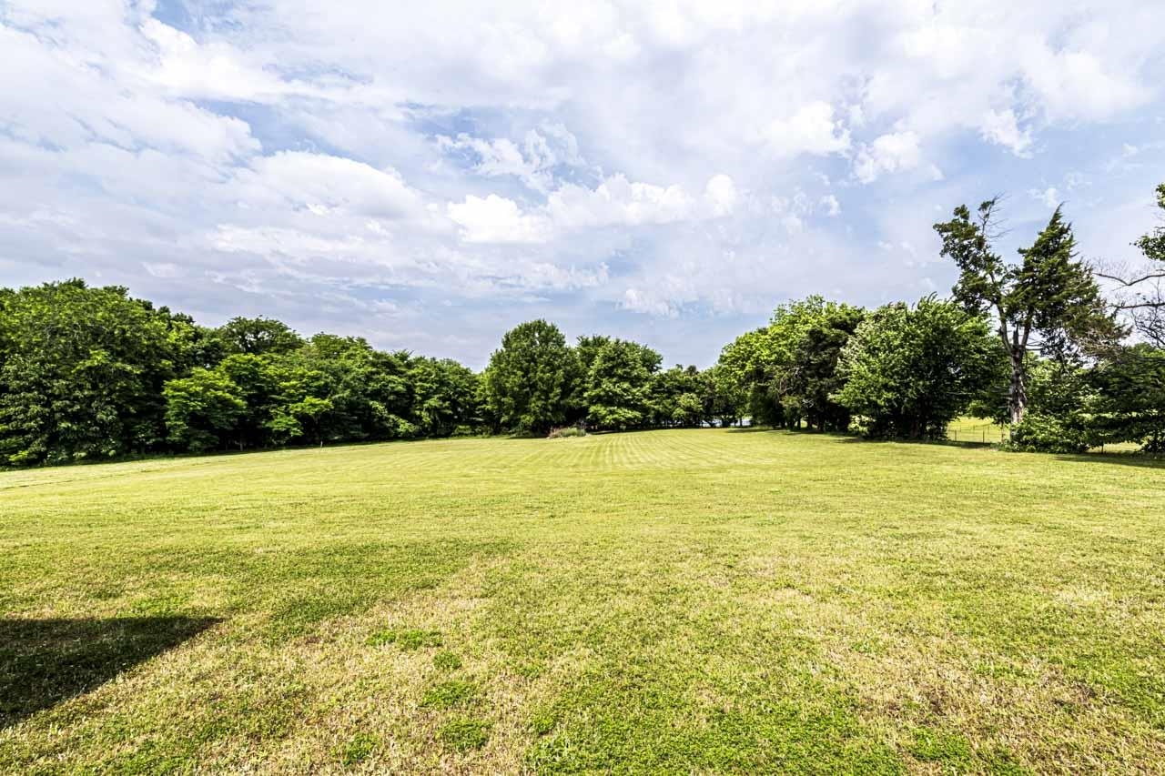 185 Belmont Road Mason, TN 38049 - Photo 37 of 38 Expansive green lawn surrounded by mature trees