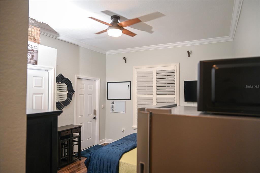 a view of a livingroom with furniture and a window