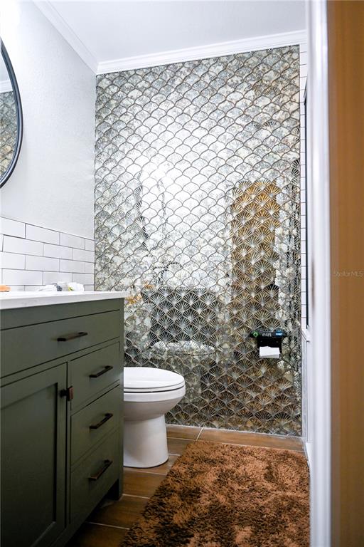 604 Morrill Court Valrico, FL 33594 - Photo 14 of 18 a bathroom with a toilet and a shower curtain