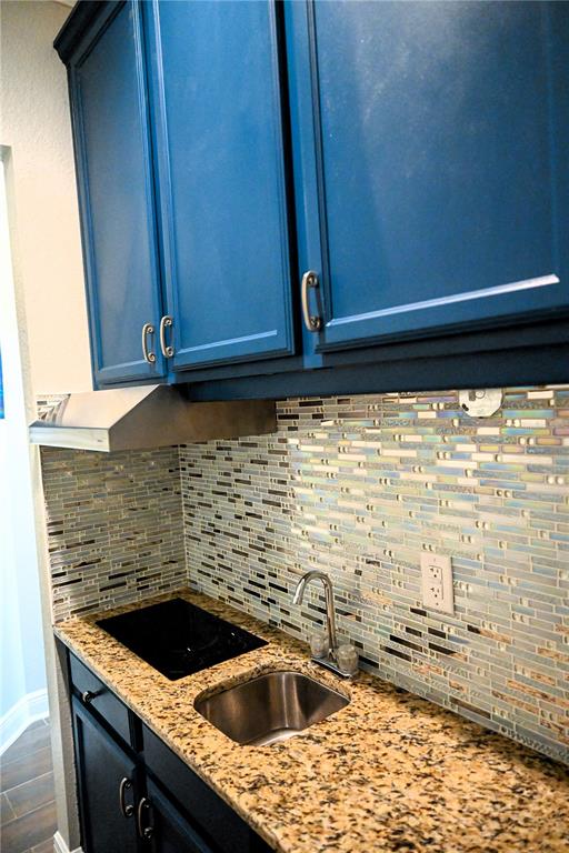 604 Morrill Court Valrico, FL 33594 - Photo 18 of 18 a kitchen sink with granite countertop white cabinets and a sink