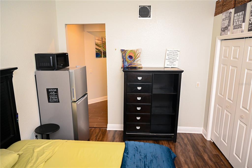 604 Morrill Court Valrico, FL 33594 - Photo 4 of 18 a bedroom with a bed and a television