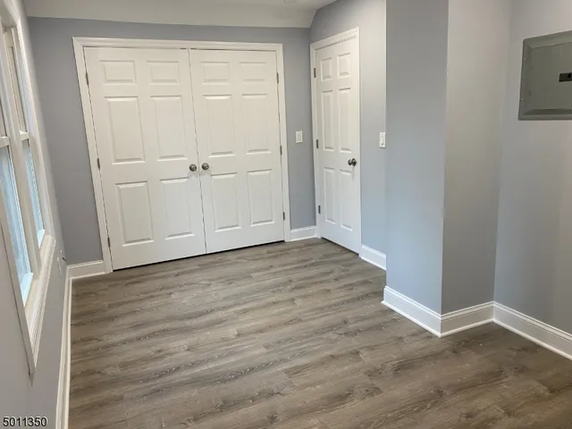 an empty room with wooden floor