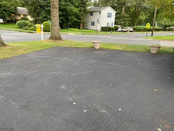 a view of a swimming pool and trees in the background