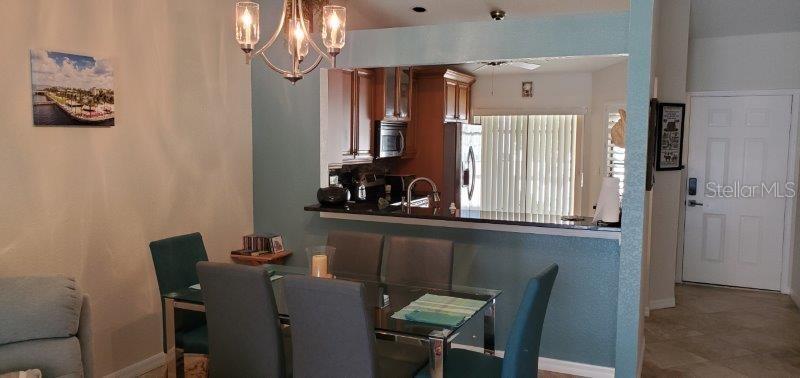 3920 Bal Harbor Boulevard, Unit E4 Punta Gorda, FL 33950 - Photo 11 of 24 a dining room with furniture and window
