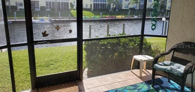 a view of a porch with furniture and outside view