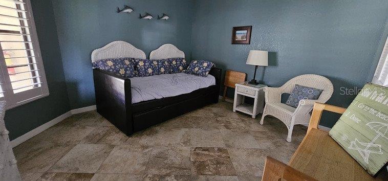 3920 Bal Harbor Boulevard, Unit E4 Punta Gorda, FL 33950 - Photo 15 of 24 a bedroom with furniture and wooden floor